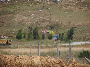 The Lebanon side of the border: Lebanon flag, Flag of Palestine and flag of Hezbollah