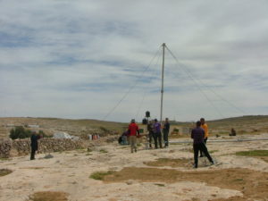 And the shorter pole is up. It used as a lever to pull up the mast of the turbine.