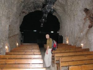 The railway tunnel, used now as a visitor center of the site. The black curtain is the Israeli - Lebanon border 