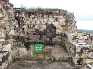Bathhouse - It is a doubtful pleasure to sit and sweat on the hard stone bench with a towel wrapped around your hips.