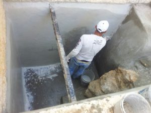 The Worker sealing the cistern with 'Sika Top 107' - Ramat Gan