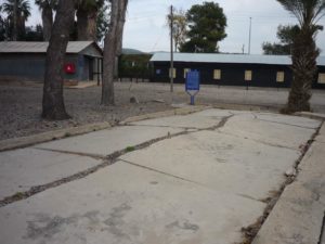 03182015-24 An empty concrete base of a demolished building and sign that mention the fact the camp was also for Jewish that caught in an illegal activities against the British. - Atlit