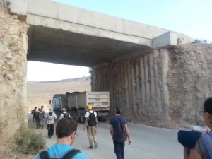 Crossing the road to the cave (you can see it is used by a quarry...)