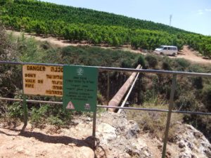  water pipe crossing the Canyon, with warnings not to cross