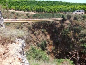  water pipe crossing the Canyon, with warnings not to cross