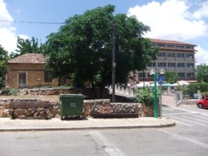 One of the small houses of the Mushava, and a new hotel next to it