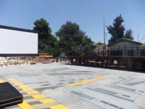 In the end of the station - a screen and a stage (an old train truck) are waiting for the bands... - Jerusalem old train station