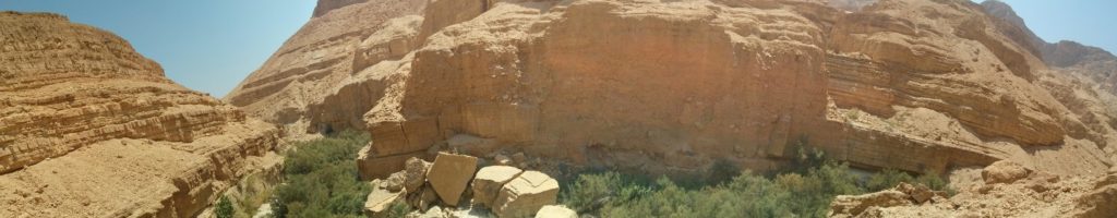 While you walk in the middle of the desert - below high cliffs and big rocks