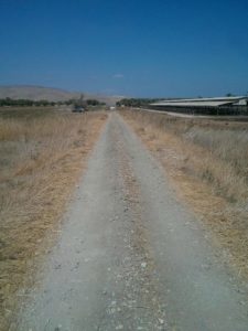 The railway route crossing the access road to Newe Ur (looking North and South) valley railway 1