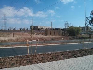 One of the buildings of the old train station, and behind an industrial complex that its building haven't finished. valley railway