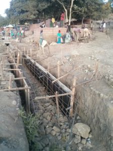 Working in the streets of Lalibela, paving them with stones and casting concrete trenches