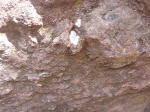 A close-up on the rock (Scoria) and the Mica mineral inside it - Monolithic Churches