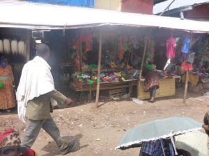 Colorful plastic shoes stand in the market of Bahir Dar. Most of the people use those shoes. - vegetable