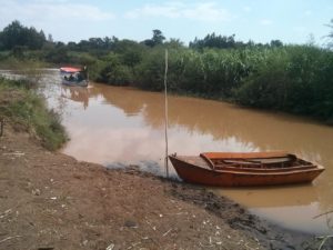 The boat crossing the Blue Nile in the end of the trail. - Blue Nile falls 