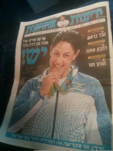 Yarden Gerbi biting the Bronze on the newspaper cover - Olympic Games