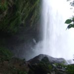 On the secret walk behind the Misol-Ha Waterfall