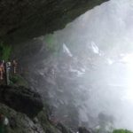 On the secret walk behind the Misol-Ha Waterfall