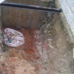 Reinforcement bars inserted into the rock to hold it and connect the rock and the concrete. - drain pipe