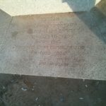 Writing explain about the memorial pillar in English and Hebrew, set by Tel Aviv Municipality in 2007.