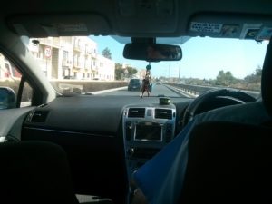 "Why he get in in the left side of the car? He is the taxi driver..."