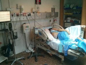 Atzva sleeping after she got the pain revilers. You can see the needle in her back. - a boy