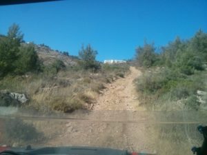 Climbing with the Polaris-RZR up toward Talmon (the building is a school)