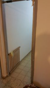 Safety gate in the entrance to the kitchen. I have installed it long ago, when I thought it will prevent the pets from getting in... - crawling