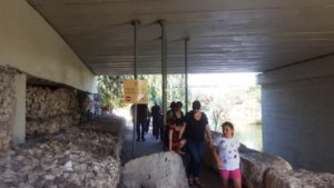 Going under the bridge. The sign an the poles are to preventing horse to enter the reserve.