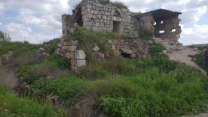 Structure from different eras: The basement is a crusades castle, the top is 1900's stone  Arab building and on the side is a Jordanian concrete and masonry structure - Latrun
