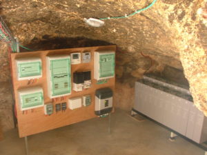 The cave below the building is used to hold the batteries (on the right) and the electrical panels.