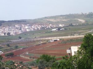  The fence along the road and and underground passage for the Palestinian of El-Jib. - Tel Gibeon