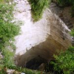 The pool from within. dug in two stages: the first is 11.8m in diameter and 10.8m in deep. The second continues 13 meter down into a water chamber, but is closed with rock.