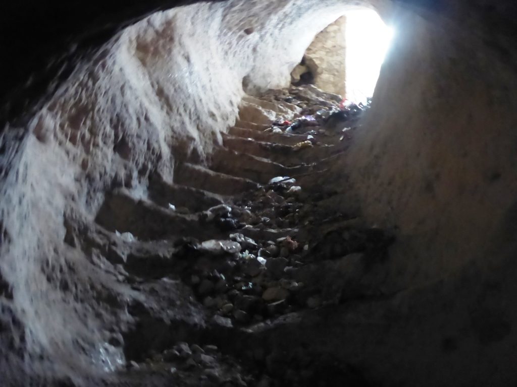 Going down the tunnel staircase of 93 stairs, leading to the spring. Unfortunately, it is full of rubbish - Tel Gibeon