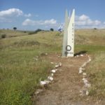 A memorial. In the bottom of each signs it is says Yom Kippur war. The small signs says "Renovated by Golan heights winery 26.04.2015". The vertical writing are the name of the dead: Eliezer Lightner, Moshe Avnaim, Aharon Aharoni.