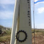 A memorial. In the bottom of each signs it is says Yom Kippur war. The small signs says "Renovated by Golan heights winery 26.04.2015". The vertical writing are the name of the dead: Eliezer Lightner, Moshe Avnaim, Aharon Aharoni.