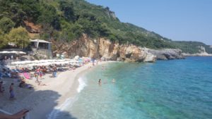 Meleopotamos beach -clear water, caves and small stones.