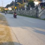 Greece roads - Bikers riding around Greece with helmets - but on their hand...