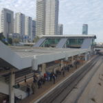 Ayalon transportation corridor: The Highway, the railway in the stream low in the concrete trench. Day and night from both sides of Tel-Aviv center train station.