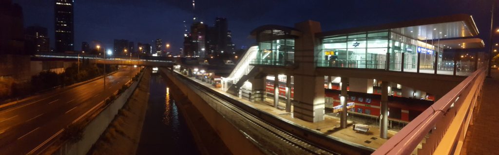 Ayalon transportation corridor: The Highway, the railway in the stream low in the concrete trench. Day and night from both sides of Tel-Aviv center train station.