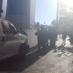 Policeman around the junction, and police tape closing the are for vehicles - Ethiopian riots