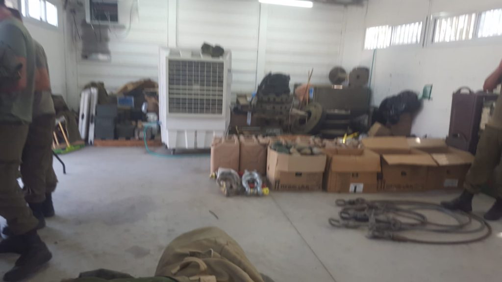hanger full of military equipment
