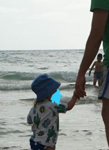 Mindal is holding my hand on Sabbath on the beach - walking