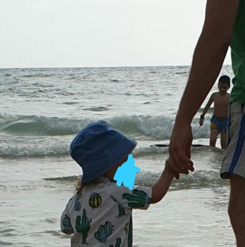 Mindal is holding my hand on Sabbath on the beach - walking