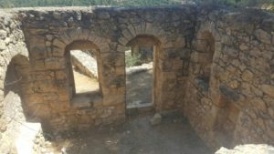 Looking inside what used to be an house in the Sataf village