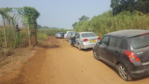 Cars parking on the side of the road, because of mad along the way. - Yarkon waterfall