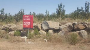 A sign on the Druze area against the planned wind farm - Wind turbines