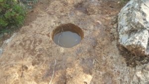 A unclear hole full of rainwater on the trail - Hanut