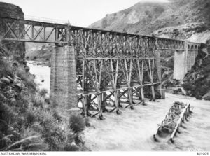 The rebuilt railway bridge over the Yarmuk River. Note the destroyed section lying in the past flowing river. (Source: Australian war memorial)