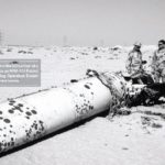 Military personnel examine the tail section of a scud missile  shot down by an-MIM 104 Patriot Air Defense Missile. (Source: Wikipedia)