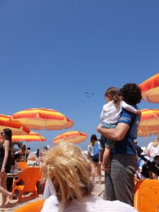 Mindal looking at the sky, but pretty quick she went down to the sand to look for seashells - Independence day air show